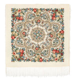 Decorative square merino wool shawl with floral patterns and fringes on a white background
