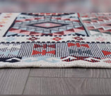 Patterned rug on a wooden floor