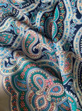 Close-up of a colorful paisley pattern women`s shawl made of wool 100%