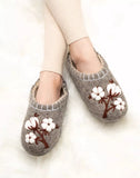 Gray handwoven slippers made of natural sheep wool with cotton flower embroidery