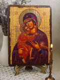 This authentic Eastern Orthodox Christian artwork icon features the Mother of God and Infant Christ over a textured gold background. Ideal for home altars, prayer spaces, or sacred gifts.