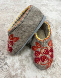 House shoes made of natural wool with red embroidery