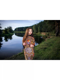 Elegant and timeless, this black merino shawl with red and yellow peony flowers is designed for a classy look. A woman wearing it can wrap it comfortably, with flowing black fringe.