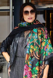 Woman wearing a colorful Slavic floral scarf with silky long fringe