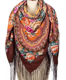 Colorful vintage floral-patterned brown scarf with fringe made of merino wool. The shawl is large and cozy.