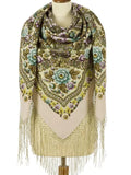 Decorative scarf with floral patterns and tassels on a mannequin against a white background