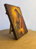 Traditional style Catholic wood art block with rustic dark edges for a home prayer altar. Vivid realistic illustration of Jesus holding Mother Mary tenderly on a thick wooden panel.