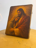 Handcrafted sacred theological home decor icon of adult Christ and the Virgin Mary standing on a table.