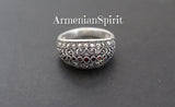 A set of sterling silver jewelry, including a ring and earrings, with marcasites and orange zircon stones, displayed against a dark background with the watermark 'ArmenianSpirit'.