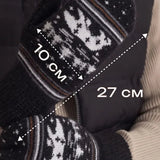 A person wearing a black puffer vest and beige sweater holds up a pair of knit winter gloves with a Nordic snowflake pattern. White text overlays show dimensions of 10 cm by 27 cm.