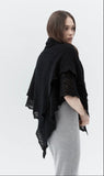 Handmade goat down black pashmina woolen shawl spread flat to showcase its delicate, intricate hand-knitted openwork pattern. The soft grey texture highlights the premium quality of the authentic gossamer material.