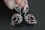 Armenian handmade sterling silver 925 jewelry including earrings and a ring with a pomegranate shape and red garnet cabochon.