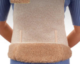 A person wearing a beige fleece waist warmer vest over a blue ribbed sweater, with a close-up inset showing the natural beige camel wool texture. 