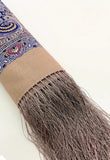 Cashmere woolen fringed shawl with purple patterns on a white background