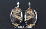 This handmade Armenian jewelry is truly unique, made with high quality sterling silver and featuring a striking coconut jasper with beautiful stripped caramel yellow and brown hues. Each piece is one of a kind, showcasing the expert craftsmanship and individuality of each design. Elevate your retro style with this one of a kind accessory matching to brown vintage dress.
