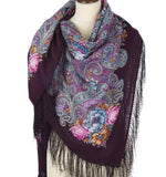 Paisley patterned deep purple women wrapping  scarf with fringes on a mannequin against a white background