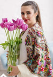 Beautiful slavic woman with large white off shawl on the shoulders and flowers in her hands.