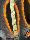  Flat-soled indoor slippers made from unlined, thick heather gray sheep's wool felt. The shoes feature a custom mismatch style where the left toe area has a detailed orange squirrel face art piece and the right toe area displays a traditional folk pattern of a branch holding a bunch of red winter berries.