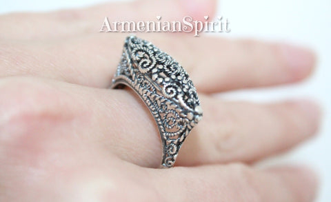 Crafted from Sterling Silver 925, our handmade Armenian filigree ring is perfect for elongating and enhancing your fingers. With its delicate design, it adds a touch of daintiness to any look. Elevate your style with this beautiful piece of jewelry.
