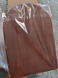 A brown rectangular icon wrapped in clear wood, held in a person's hand against a gray textured background.