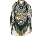 Floral patterned vintage wrapping scarf with fringes on a mannequin against a white background