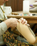 The process of making a handwoven slippers.