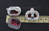 Silver earrings with red gemstones on a black background with 'Armenian Spirit' branding.