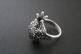 Silver pomegranate-shaped Armenian ring on a dark background