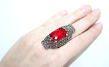 This high quality sterling silver set from Armenian Spirit features a very large cosplay queen ring with a shiny red stone and intricate marcasite details. With a Mid century design, this elegant jewelry set is perfect for the actress who wants to make a statement both on and off the stage.