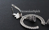 Silver necklace with 'Armenian Spirit' English lock earring on a dark background