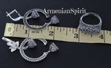 Silver jewelry pieces on a ruler with 'Armenian Spirit' branding.