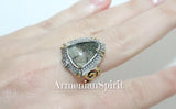 Silver ring with a large gemstone on a hand, branded 'Armenian Spirit'.