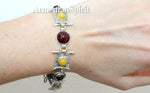 Expertly crafted using high quality sterling silver and adorned with a 925 stamp, this women's bracelet features vivid yellow jadeite and rich red natural garnet gemstones. The gold plated details add a touch of elegance to this handmade piece. Elevate any outfit with this colorful and unique accessory.
