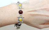 Expertly crafted using high quality sterling silver and adorned with a 925 stamp, this women's bracelet features vivid yellow jadeite and rich red natural garnet gemstones. The gold plated details add a touch of elegance to this handmade piece. Elevate any outfit with this colorful and unique accessory.
