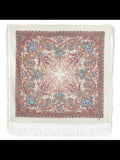 Square woolen scarf with Indian paisley and mandala pattern pink and turquoise delicate herbal elements and white fringe on a plain background