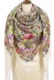 Colorful floral and paisley patterned merino wool scarf with fringes in ivory, pink and purple  on a mannequin.