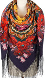 Close-up detail focusing on the soft texture of a colorful bohemian-style wool scarf. The heritage Slavic design features layers of large, bright vintage blossoms and complex traditional ornaments, draped to reveal its cozy fabric layers and flowing fringe trim.