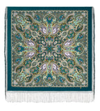 Decorative large shawl in teal and yellow with intricate paisley pattern on a teal background