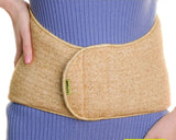 Medical low back warmer belt wide made of natural camel wool in beige on a woman`s waist in a blue dress. 100% Camel Wool Waist Support Belt.