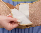 Medical camel wool wide belt on a woman showing that it can be made into different sizes on a waist.