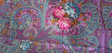 Colorful retro shawl with paisley pattern and pink flowers on a purple background