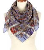 Paisley patterned woolen purple scarf without a fringe on a mannequin with a white background