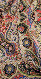 Close-up of a colorful paisley pattern savic shawl