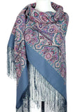 Paisley patterned light blue oversized scarf with fringes on a mannequin against a white background