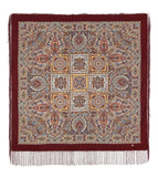 Decorative square shawl with intricate patterns and fringes on a white background