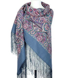 Paisley patterned scarf with fringes on a mannequin against a white background