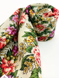 Floral patterned merino-wool-shawl roll on a white background