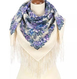 Merino wool women scarf with purple floral pattern and fringes on a mannequin against a white background