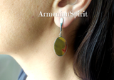 Buy flat gemstone earrings oval with leverback which will match to pale green small dress with open shoulders. The stone is matte but well polished. The mookaite gemstone is a rare type of jasper. This stone has also small red marks which look very attractive with pale salad green solor.