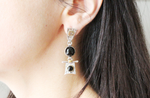 Black onyx earrings silvr on the earlobe photo